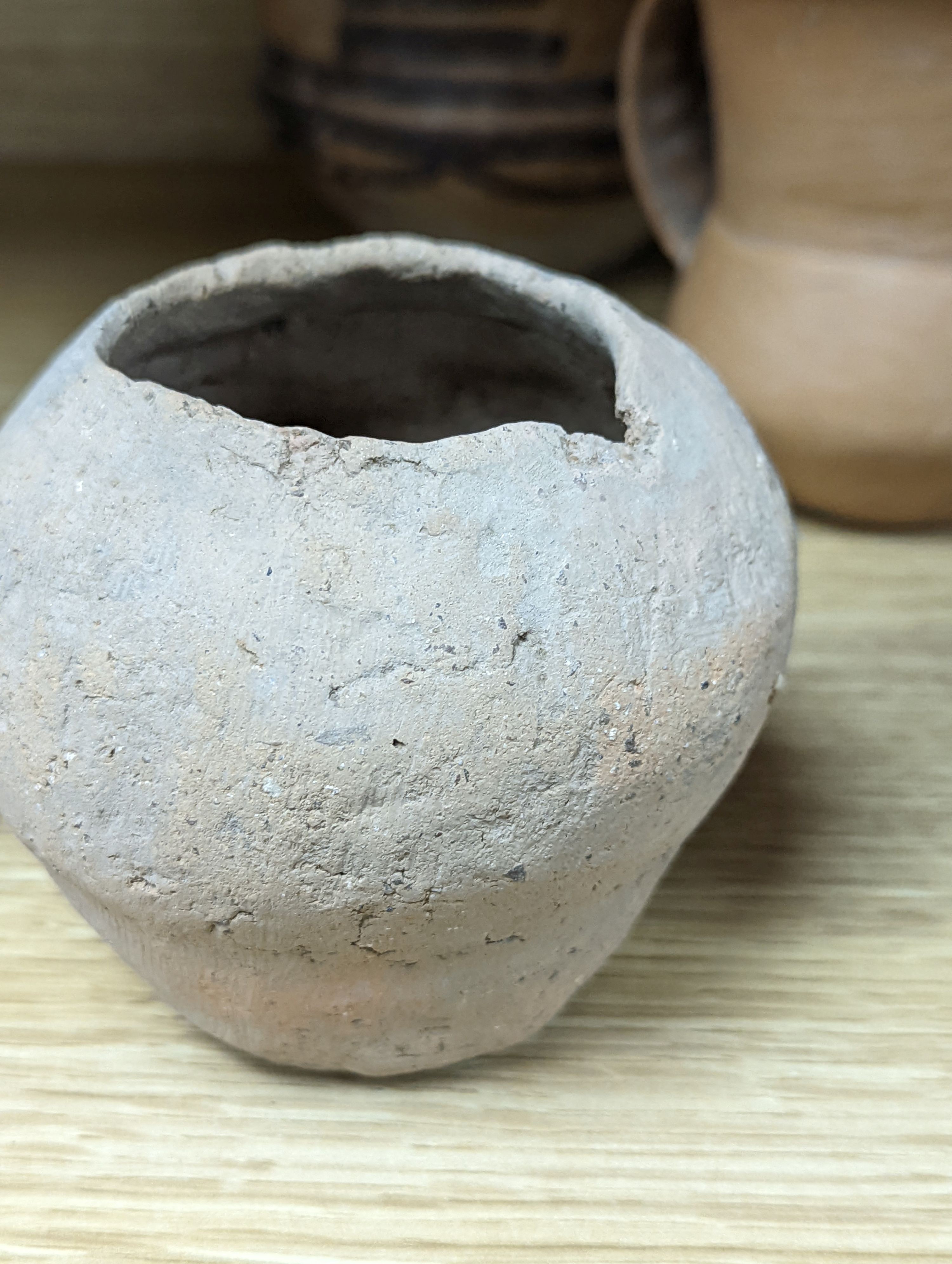 Four Chinese Neolithic pottery vessels, 11cm